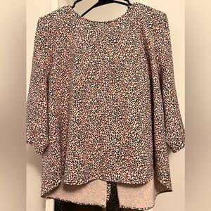 Poly top with knotted closure to the back.